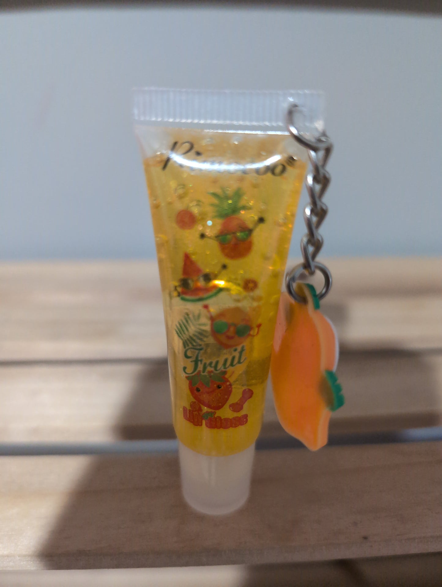 Charm lip gloss