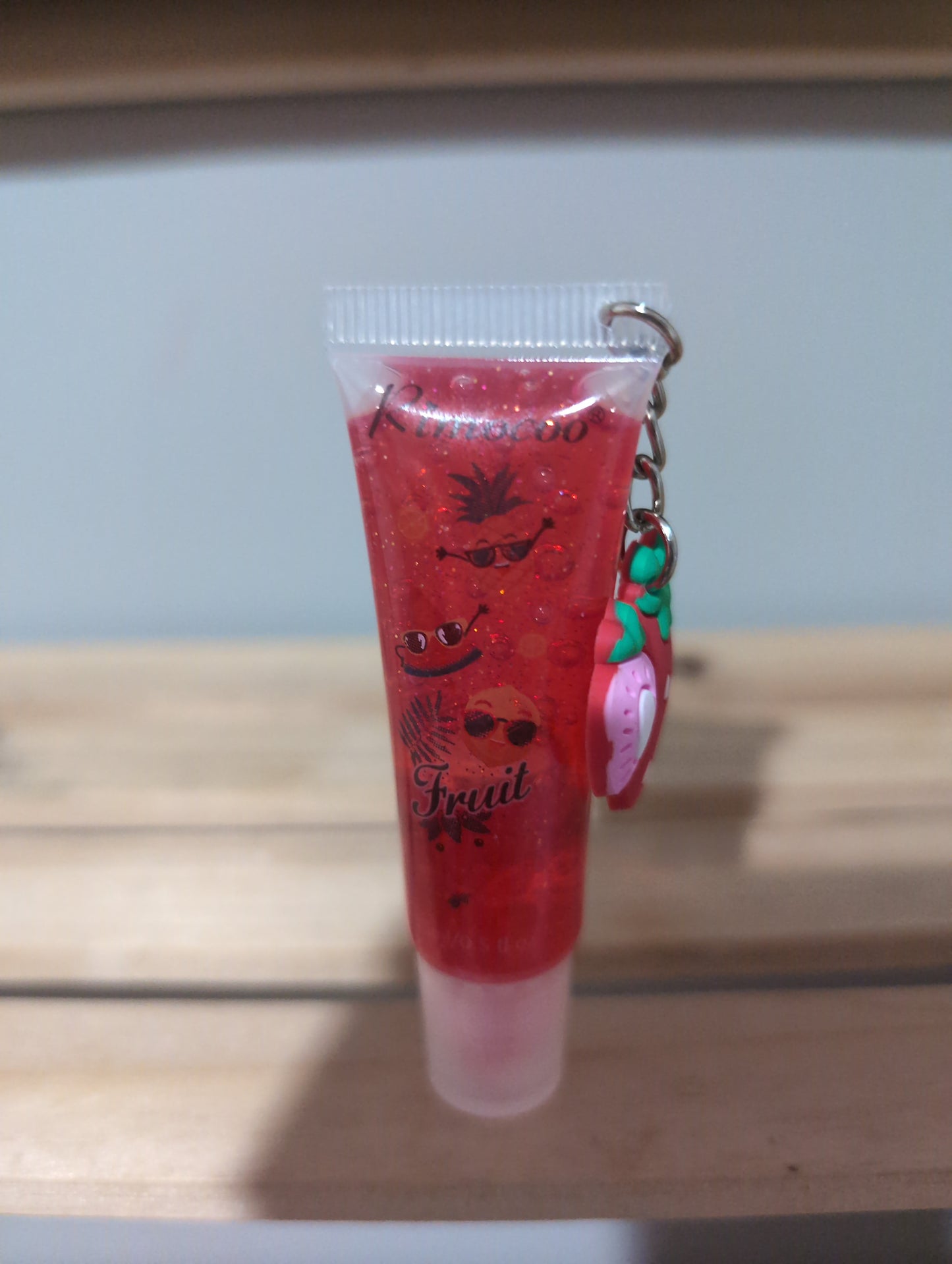 Charm lip gloss